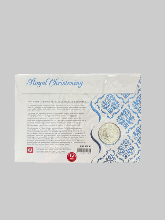 Royal Christening package on a desk with a keyboard in the background