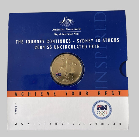 Australian Olympic gold coin in a blue and white packaging with text and logos.